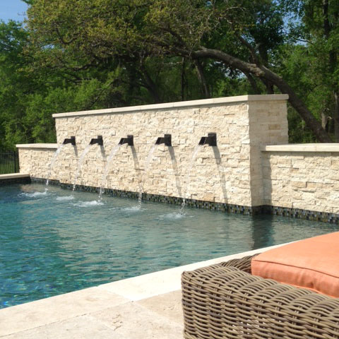 spout mounted on pool wall