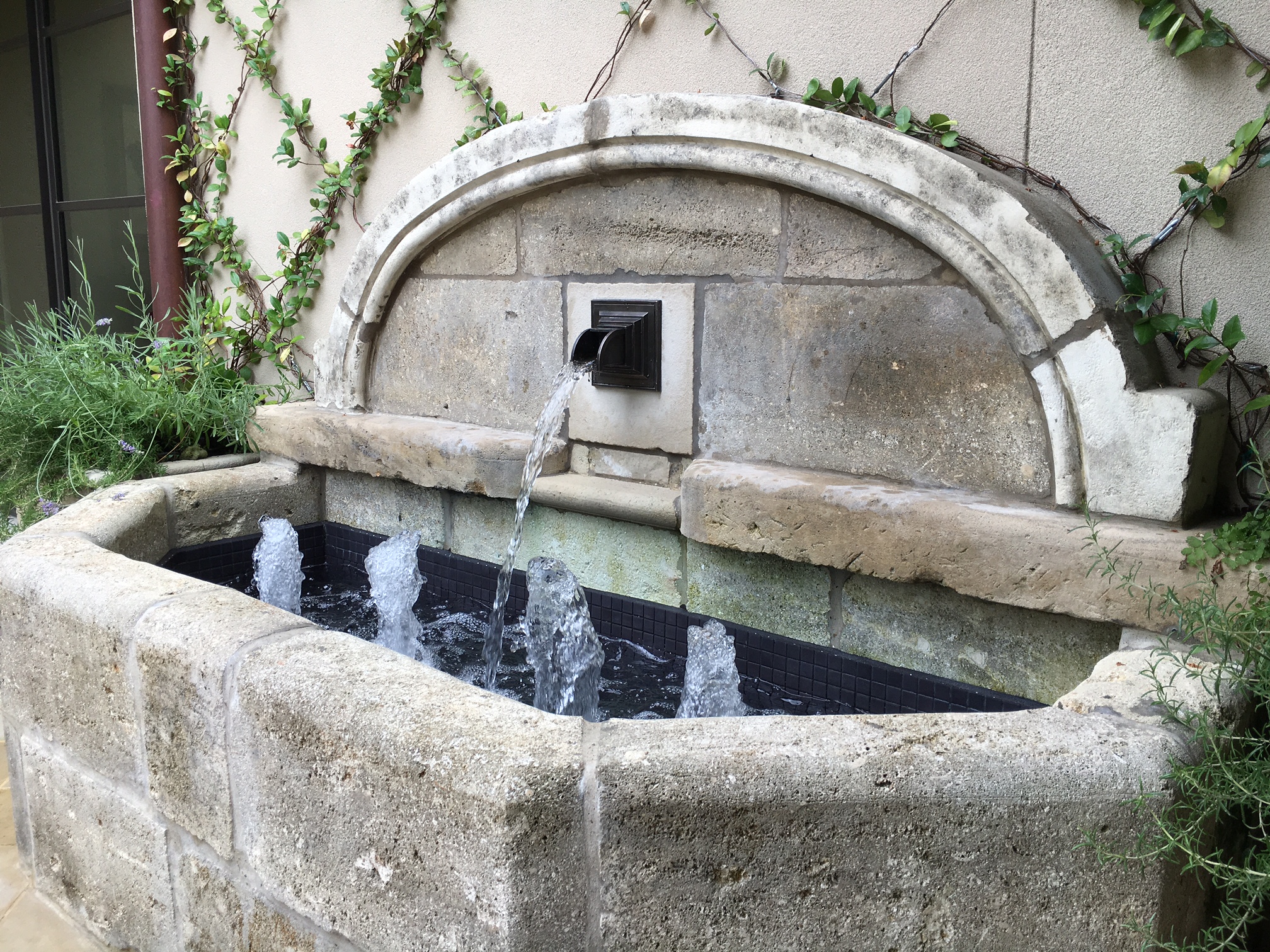 Big-Kepik bronze fountain spout used in a typical carved stone fountain