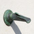 Ramon fountain spout with heavy verdigris patina