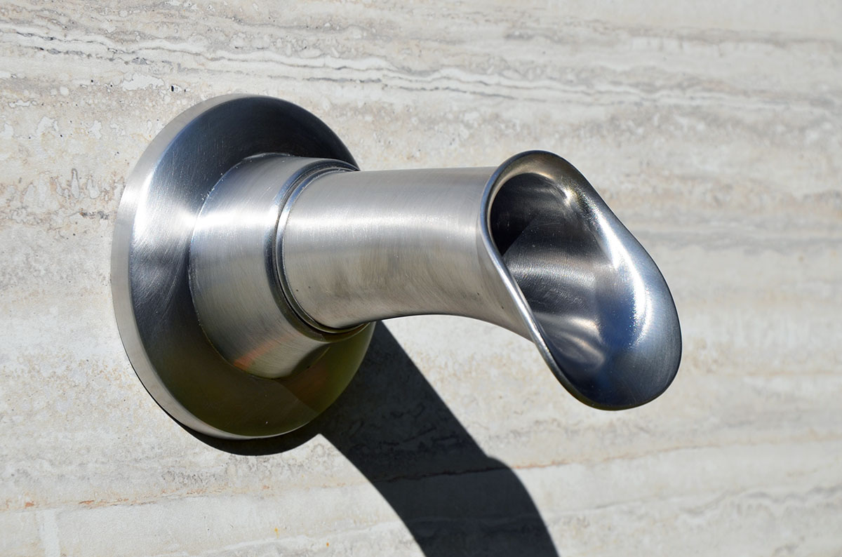 The Stainless-Oona: a bronze fountain spout with a round cross section and elegant flare